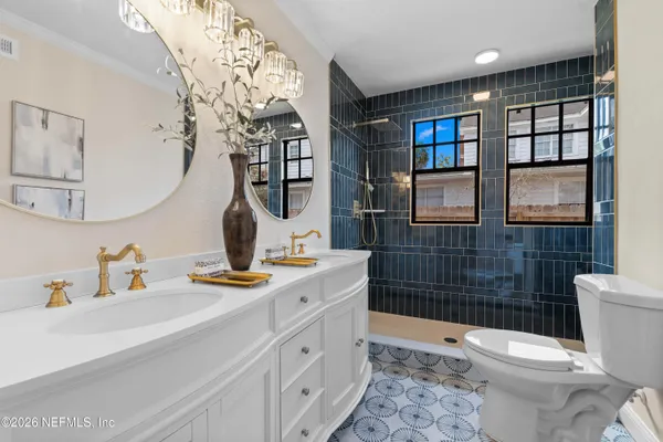 an aerial view of residential house with outdoor space and swimming pool