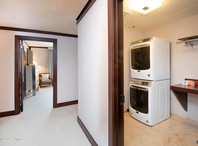 a view of a hallway with washer and dryer
