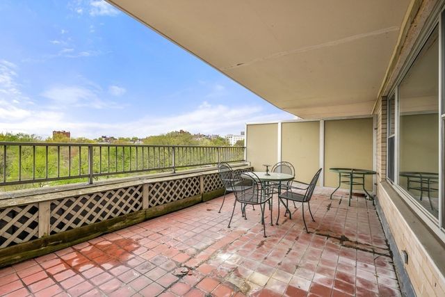 a view of a chairs and table on the terrace