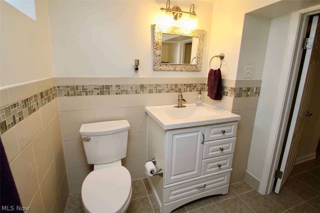 30875 Roosevelt Road Wickliffe, OH 44092 - Photo 27 of 35 New toilet and vanity in 2019.