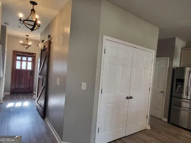 a kitchen with a refrigerator and a stove