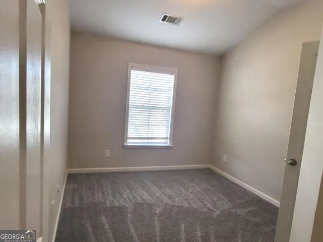 a view of a kitchen with a sink and chandelier