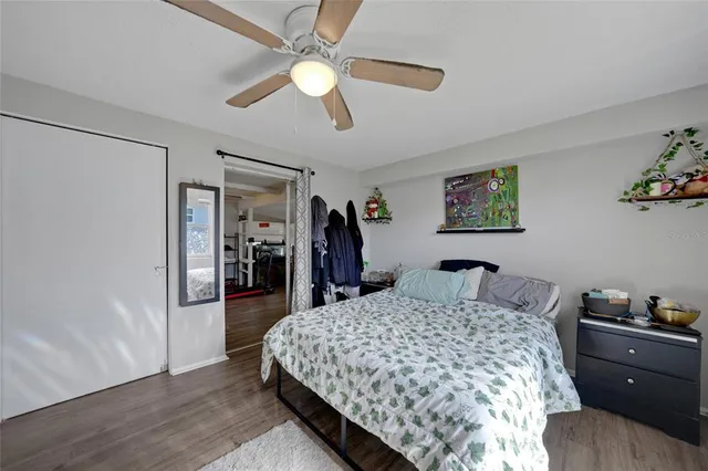 a bed room with a bed and a chandelier