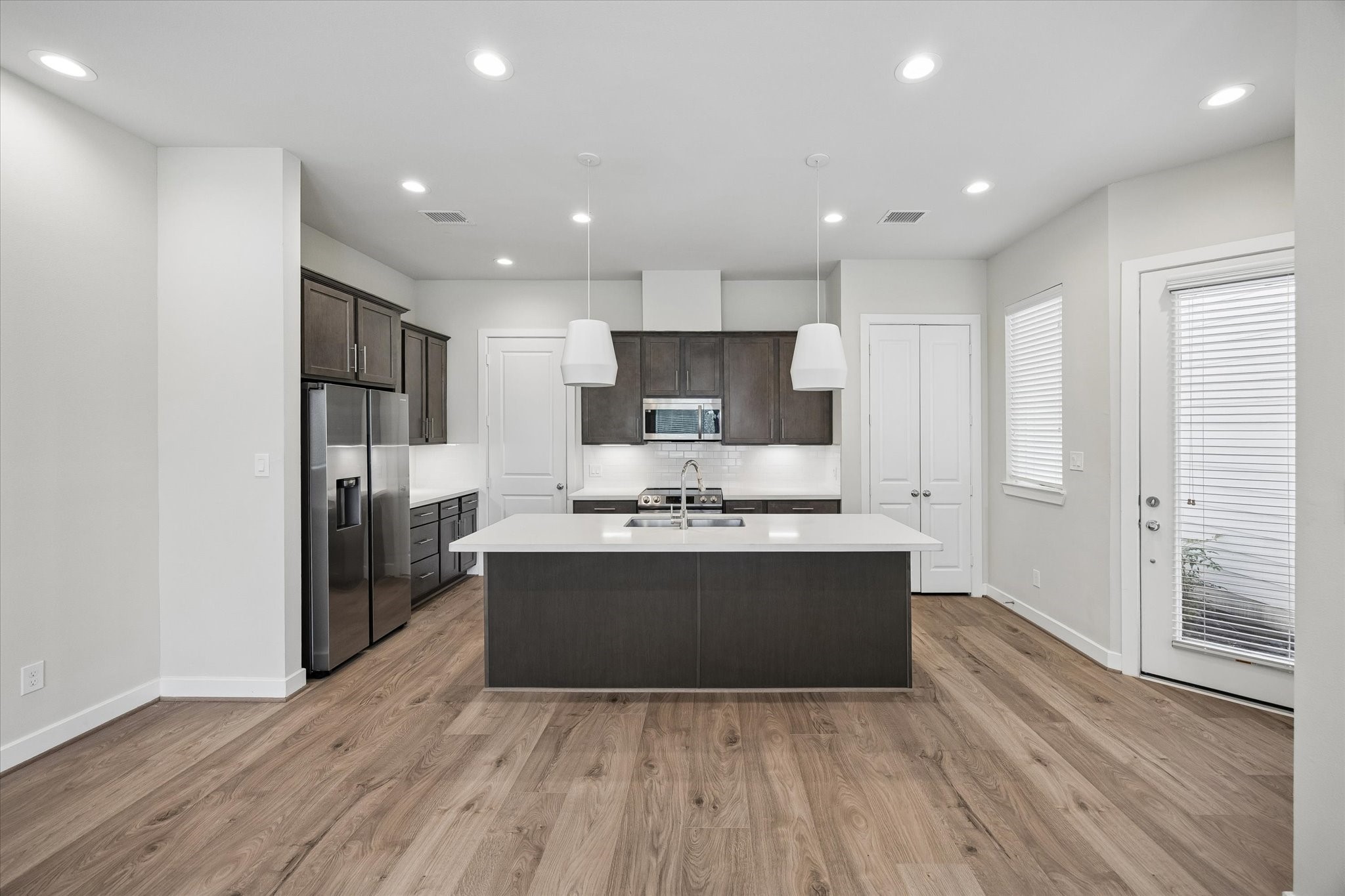5914 Haring Lane Houston, TX 77091 - Photo 2 of 11 a view of kitchen with stainless steel appliances granite countertop a stove and a refrigerator
