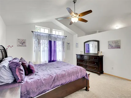 a spacious bathroom with a granite countertop tub sink and mirror