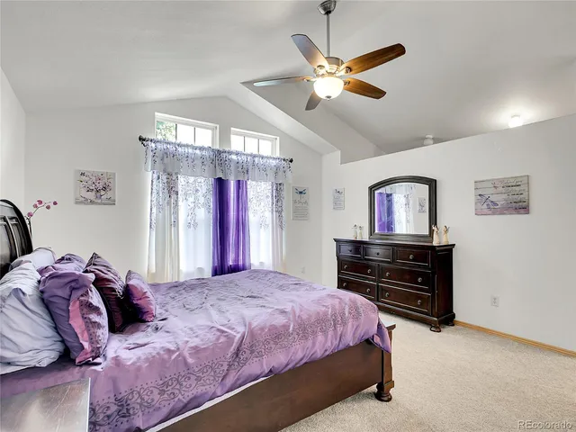 a spacious bathroom with a granite countertop tub sink and mirror