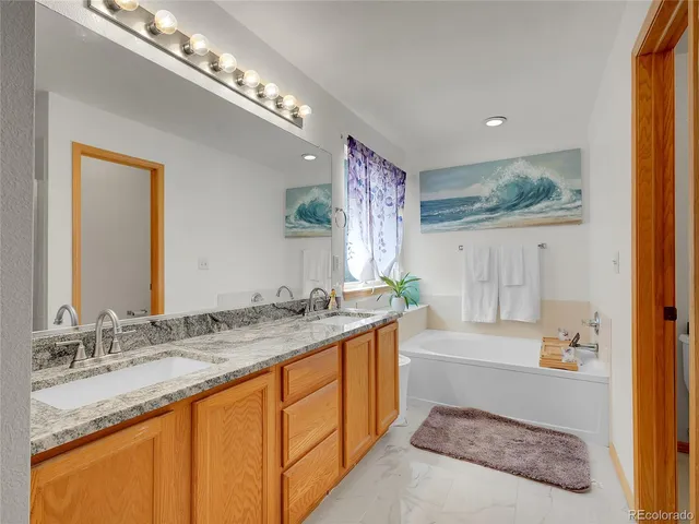 a room with a bookshelf and a stove top oven