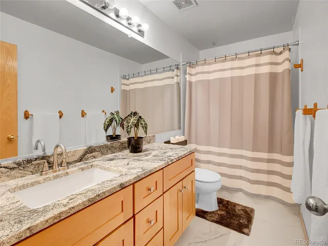 a bedroom with furniture and windows