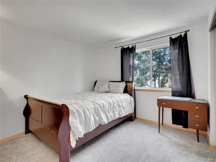 a view of backyard with a chair under a house
