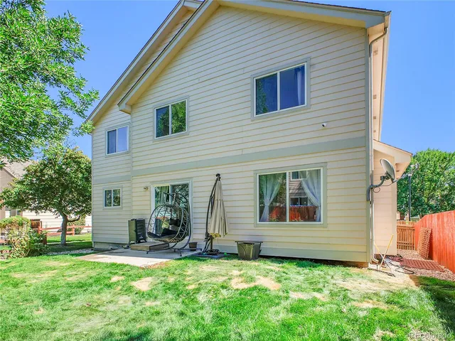a view of a backyard with a small cabin