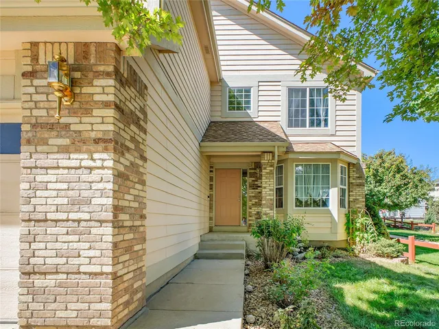 a aerial view of a house with a yard
