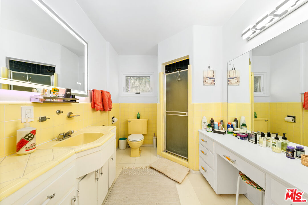 1330 North Crescent Heights Boulevard, Unit 16 West Hollywood, CA 90046 - Photo 11 of 25 a spacious bathroom with a tub sink and mirror