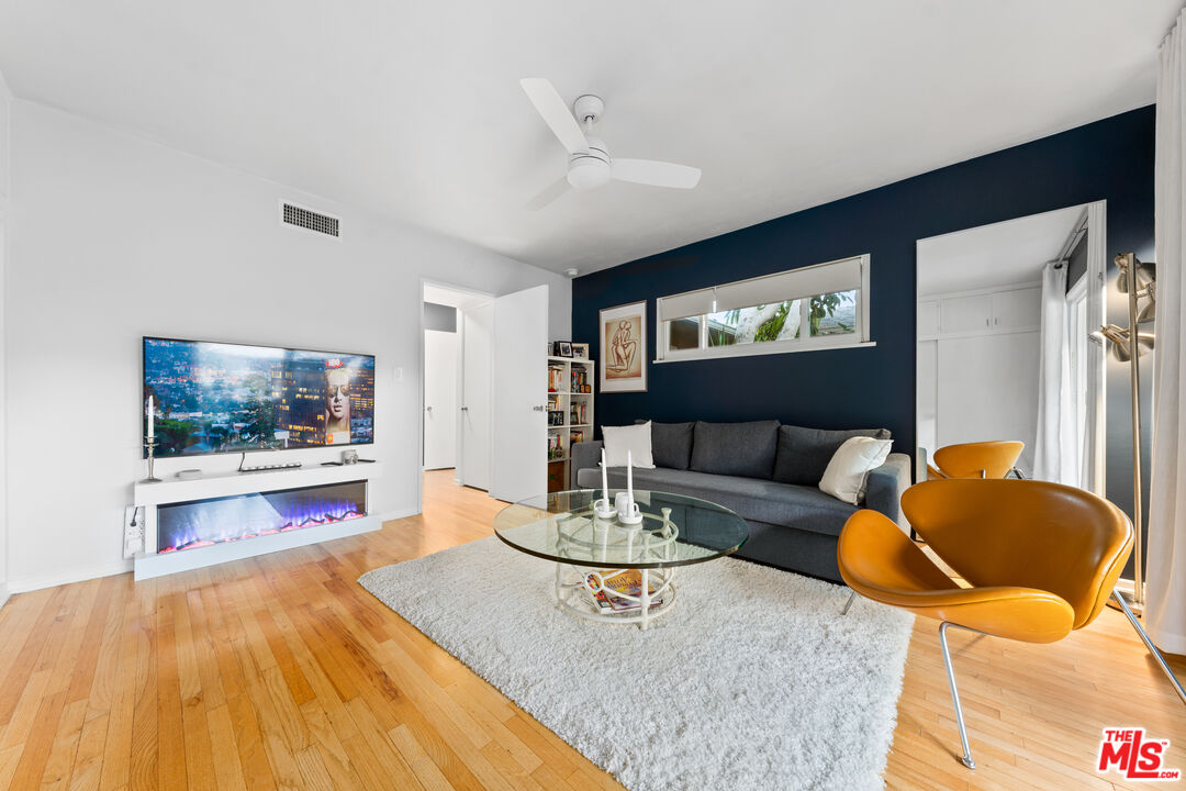 1330 North Crescent Heights Boulevard, Unit 16 West Hollywood, CA 90046 - Photo 14 of 25 a living room with furniture and a flat screen tv