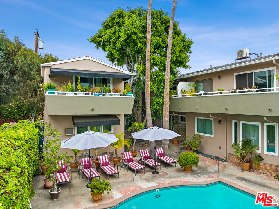 1330 North Crescent Heights Boulevard, Unit 16 West Hollywood, CA 90046 - Photo 20 of 25 a front view of a house with yard and sitting area
