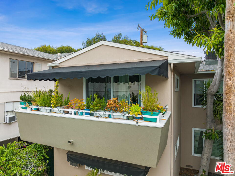 1330 North Crescent Heights Boulevard, Unit 16 West Hollywood, CA 90046 - Photo 22 of 25 front view of house with a yard