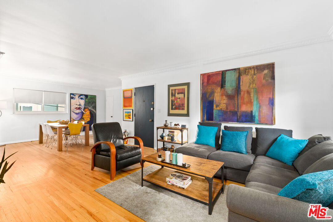 1330 North Crescent Heights Boulevard, Unit 16 West Hollywood, CA 90046 - Photo 5 of 25 a living room with furniture and a wooden floor