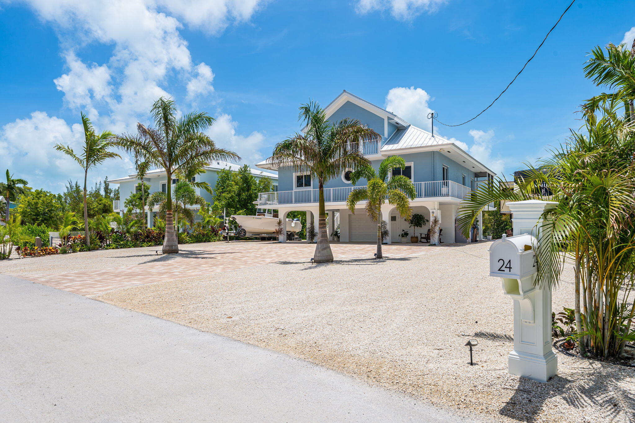 24 Mutiny Place Key Largo, FL 33037 - Photo 58 of 69 a view of a house with a yard and garage