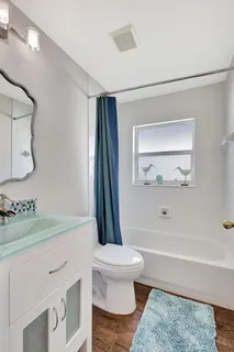 a bathroom with a sink a toilet and a bathtub