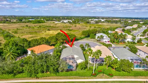 an aerial view of a house with a swimming pool yard and outdoor seating