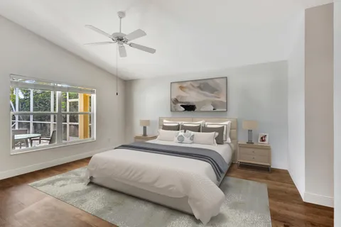 a bedroom with a large bed and a window