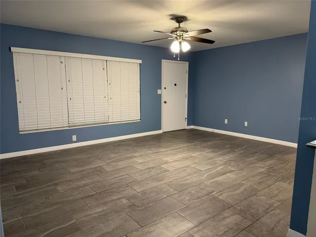 a view of an empty room with a window