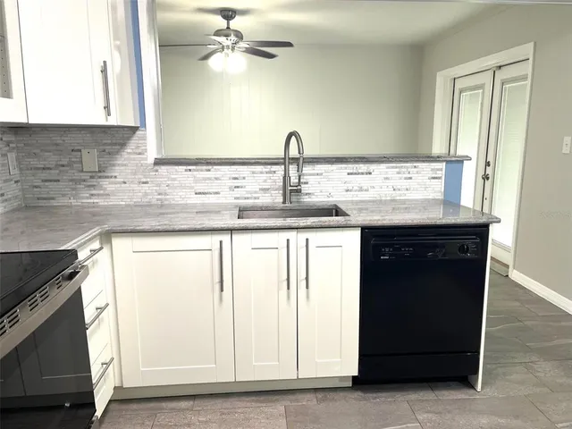a kitchen with a sink and cabinets