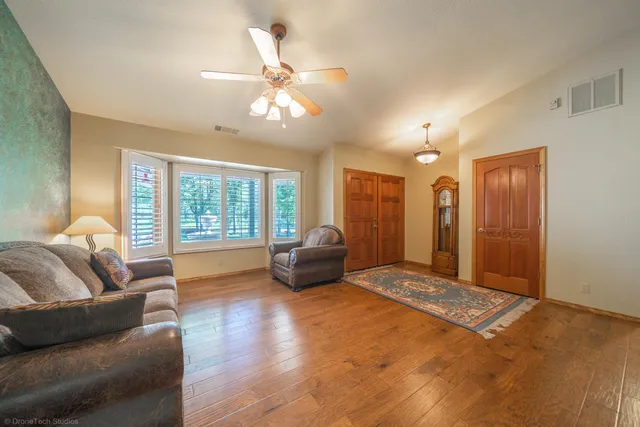 a living room with furniture and a large window