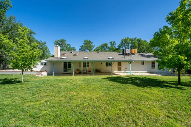 a aerial view of a house with a big yard