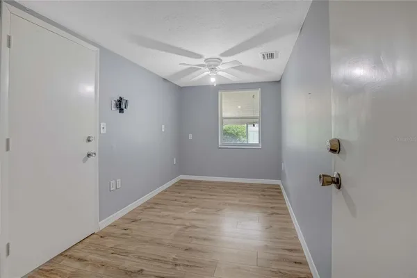 a view of an empty room with a window