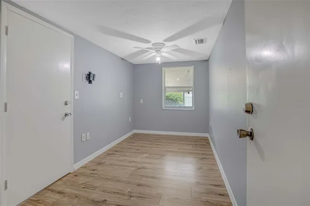 a view of an empty room with a window