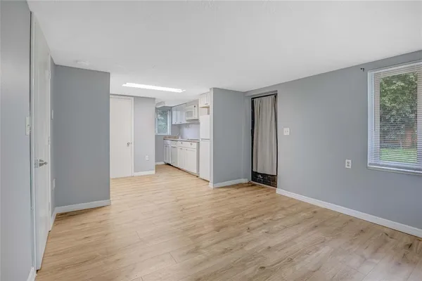 a view of an empty room with a window