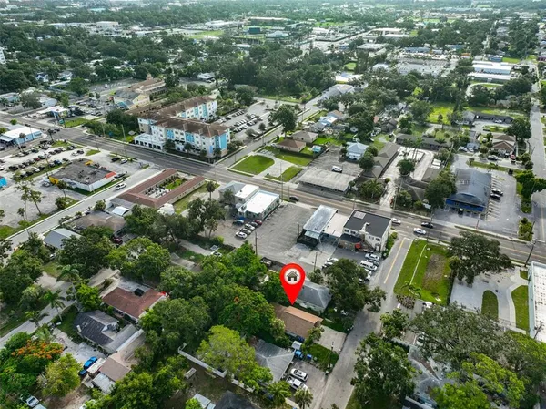 an aerial view of residential houses with outdoor space