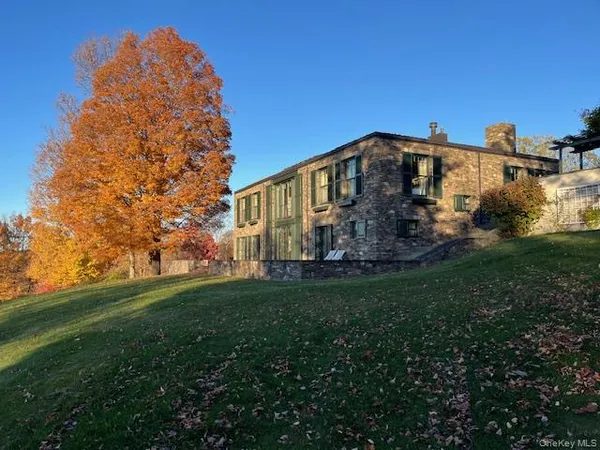 a view of a swimming pool with lounge chairs