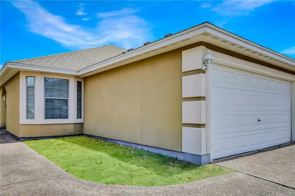 a view of a backyard with potted plants