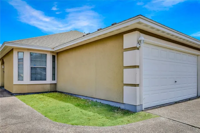 a view of a backyard with potted plants