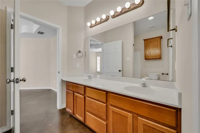 a bathroom with a sink a shower and a mirror