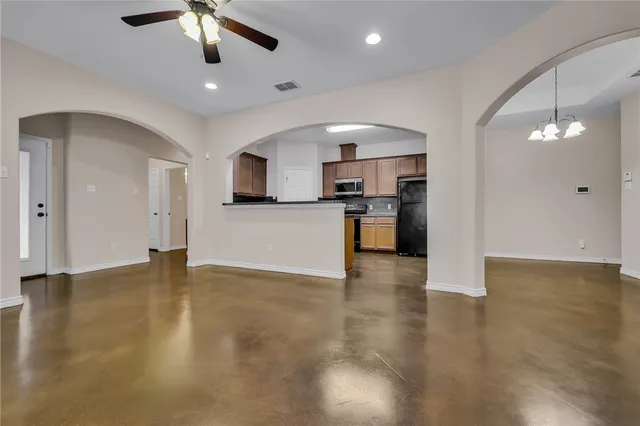 a view of a kitchen with a stove cabinets and wooden floor
