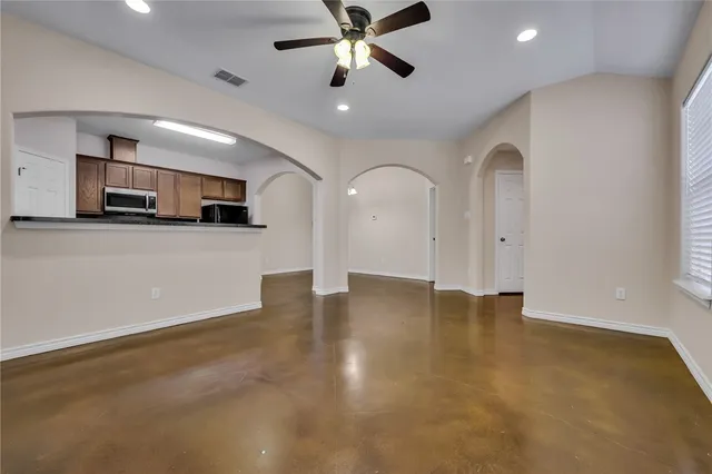 a view of a kitchen with a sink and cabinets