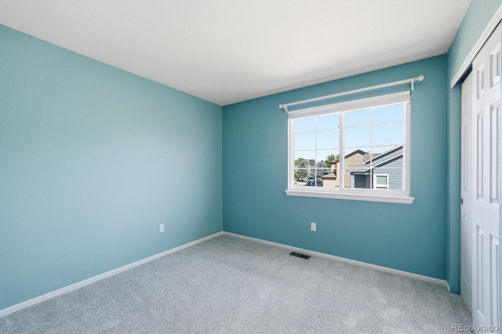9629 Burberry Way Highlands Ranch, CO 80129 - Photo 30 of 50 an empty room with a window