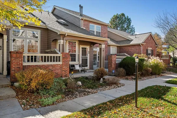 a view of a front of a house with a small yard