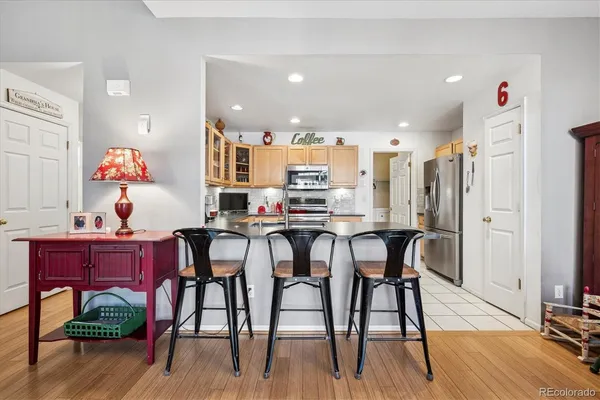 a view of a dining room with furniture and wooden floor