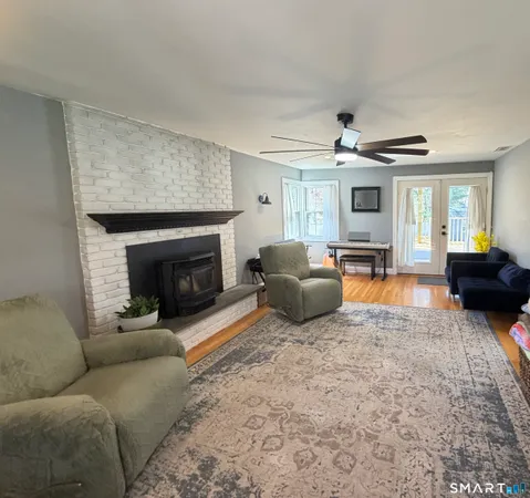 a bedroom with bed and a flat screen tv