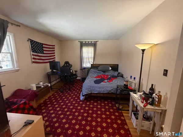 a view of a kitchen with furniture and an empty room