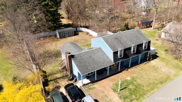 an aerial view of a house with swimming pool