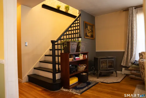 a bedroom that has a bed and a chandelier