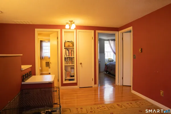 a bedroom with bed and window