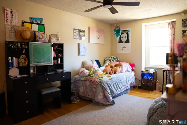 a bedroom with a bed and dresser