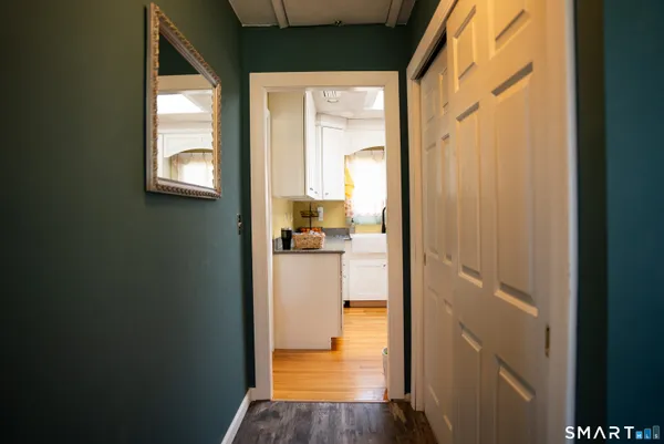 a kitchen with granite countertop stainless steel appliances and wooden cabinets