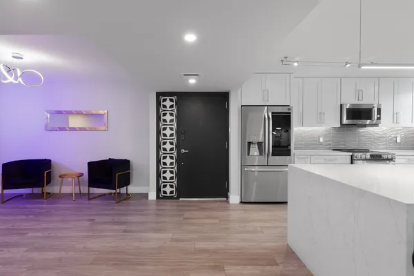 a living room with furniture and a flat screen tv