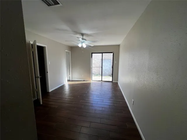 wooden floor in an empty room with a gallery